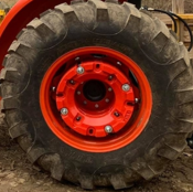 LM8124 TRACTOR WHEEL WEIGHT MOUNTED ON WHEEL.